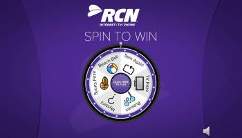 Logo-branded prize wheel game with a QR code entry screen