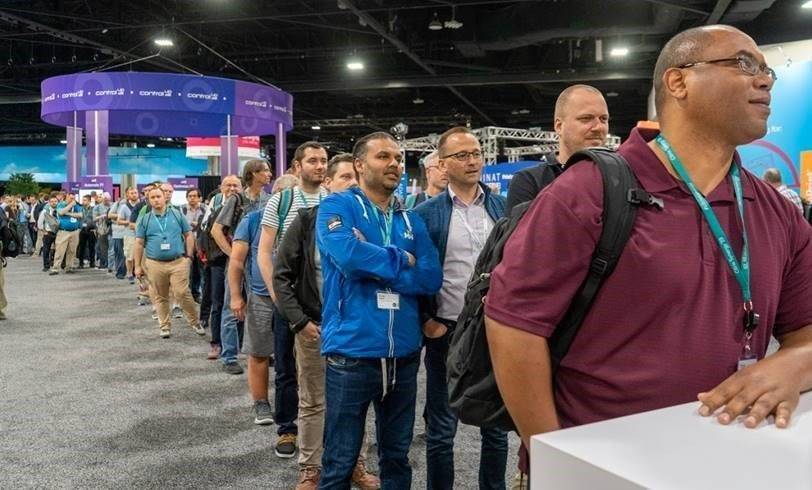 Convention attendees at an Expo waiting to engage with a brand experience for lead generation