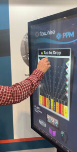 Attendee playing a virtual Plinko game for lead generation at a corporate convention
